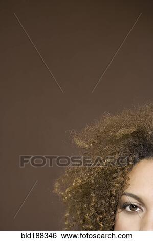 Stock Photograph - Mixed Race woman with curly hair. Fotosearch