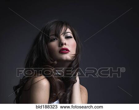 Mixed Race woman with hand in hair View Large Photo Image Stock Image - Mixed Race woman with hand in hair. Fotosearch