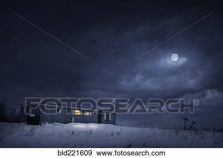 Stock Photo - Moon over trailer house in snowy yard. Fotosearch