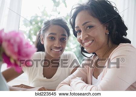 Stock Photography - Mother and daughter smiling. Fotosearch