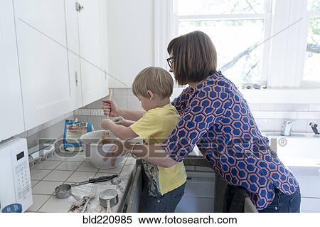 Mother and son baking in kitchen View Large Photo Image Stock Photography - Mother and son baking in kitchen. Fotosearch