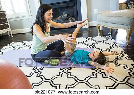Stock Photo - Mother and son playing on floor. Fotosearch
