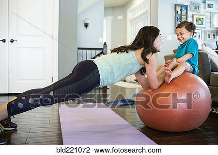 Mother and son playing with exercise ball View Large Photo Image Stock Image - Mother and son playing with exercise ball. Fotosearch