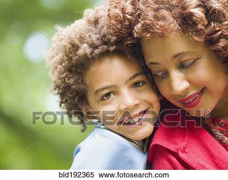 Stock Photography - Mother and son smiling. Fotosearch
