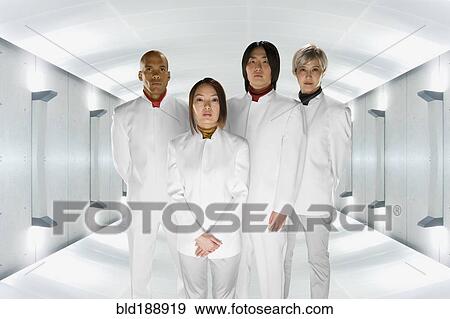 Multi-ethnic co-workers in futuristic setting View Large Photo Image Stock Photo - Multi-ethnic co-workers in futuristic setting. Fotosearch
