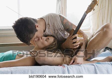 Multi-ethnic couple kissing View Large Photo Image Picture - Multi-ethnic couple kissing. Fotosearch