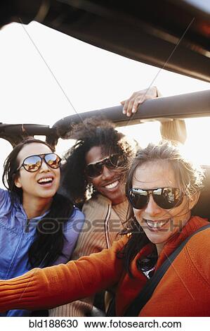 Multi-ethnic friends on roadtrip View Large Photo Image Stock Image - Multi-ethnic friends on roadtrip. Fotosearch