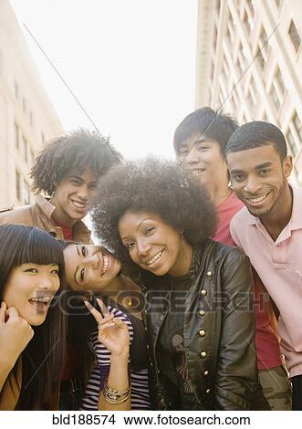 Multi-ethnic friends smiling View Large Photo Image Picture - Multi-ethnic friends smiling. Fotosearch