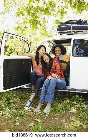 Stock Photo - Multi-ethnic group of friends on camping trip. Fotosearch