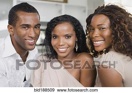 Multi-ethnic man and women smiling View Large Photo Image Stock Photo - Multi-ethnic man and women smiling. Fotosearch