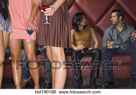 Stock Photograph - Multi-ethnic people at nightclub. Fotosearch