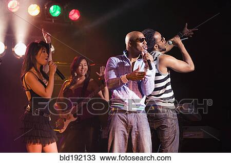 Musical group performing onstage View Large Photo Image Stock Image - Musical group performing onstage. Fotosearch