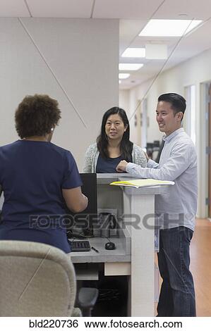 Nurse and patients talking in hospital View Large Photo Image Stock Photograph - Nurse and patients talking in hospital. Fotosearch