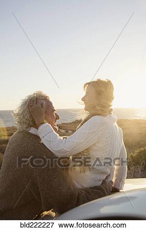 Older Caucasian couple hugging outdoors View Large Photo Image Stock Photo - Older Caucasian couple hugging outdoors. Fotosearch
