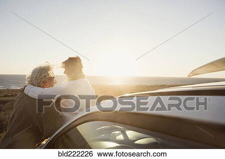 Older Caucasian couple hugging outdoors View Large Photo Image Stock Photograph - Older Caucasian couple hugging outdoors. Fotosearch