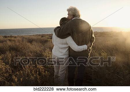 Older Caucasian couple looking at ocean view View Large Photo Image Stock Photo - Older Caucasian couple looking at ocean view. Fotosearch