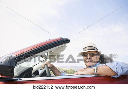 Older Caucasian man driving convertible View Large Photo Image Stock Image - Older Caucasian man driving convertible. Fotosearch
