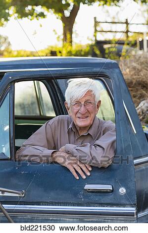 Older Caucasian man sitting in truck View Large Photo Image Stock Image - Older Caucasian man sitting in truck. Fotosearch