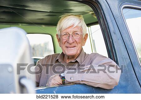 Older Caucasian man sitting in truck View Large Photo Image Stock Photo - Older Caucasian man sitting in truck. Fotosearch