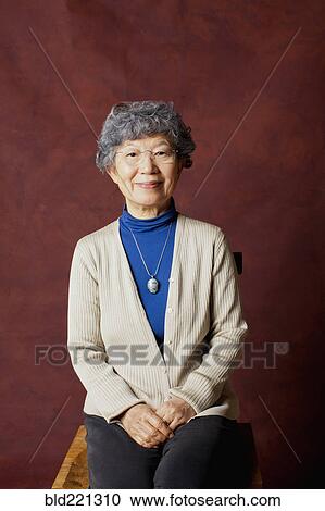Stock Image - Older Japanese woman smiling. Fotosearch