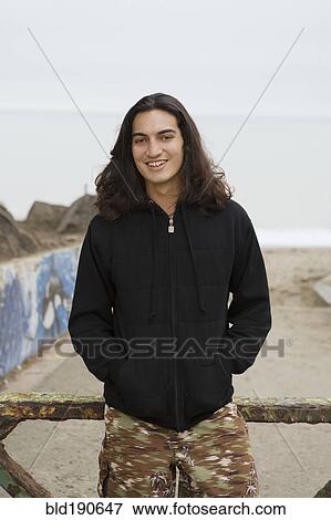 Stock Photo - Pacific Islander man with hands in pockets. Fotosearch