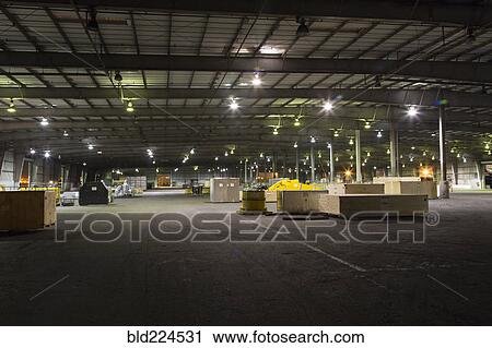Stock Image - Pallets and containers in warehouse. Fotosearch