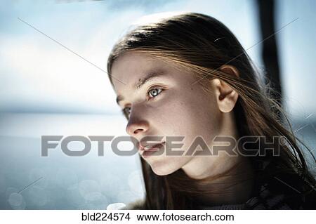 Pensive Caucasian girl at lake View Large Photo Image Picture - Pensive Caucasian girl at lake. Fotosearch