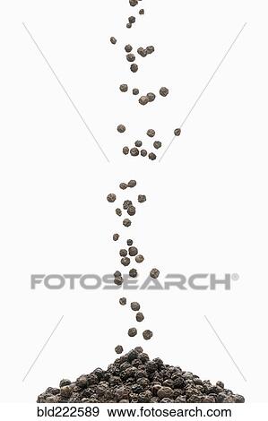 Peppercorn pouring into pile View Large Photo Image Stock Photo - Peppercorn pouring into pile. Fotosearch