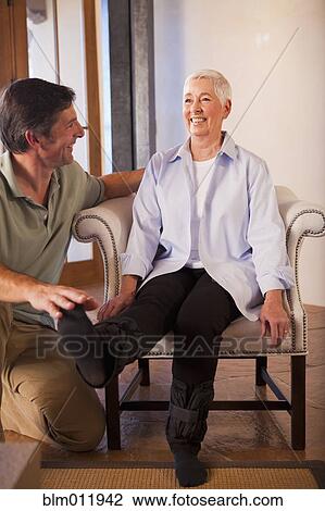 Physical therapist helping woman with exercises View Large Photo Image Stock Image - Physical therapist helping woman with exercises. Fotosearch