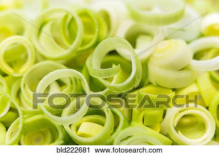 Stock Image - Pile of fresh raw onion rings. Fotosearch