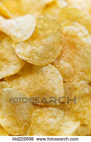Stock Photo - Pile of potato chips. Fotosearch