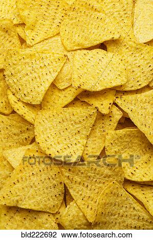 Stock Image - Pile of tortilla chips. Fotosearch