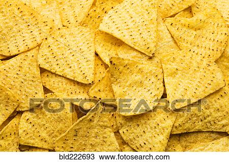 Stock Image - Pile of tortilla chips. Fotosearch