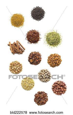 Piles of nuts and seasonings View Large Photo Image Stock Photo - Piles of nuts and seasonings. Fotosearch