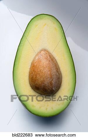 Stock Image - Pit in sliced avocado. Fotosearch