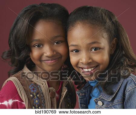 Stock Photo - Portrait of girls smiling. Fotosearch