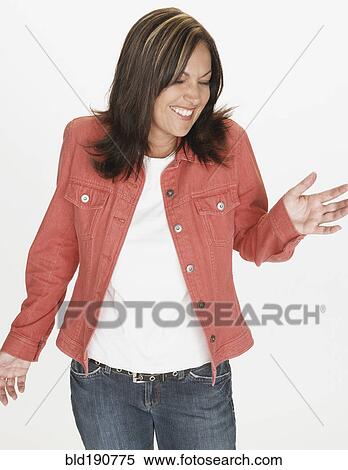 Stock Photography - Portrait of Hispanic woman dancing with eyes closed. Fotosearch