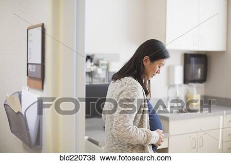Stock Photo - Pregnant Chinese woman in hospital room. Fotosearch