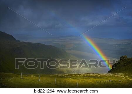 Picture - Rainbow over rural landscape. Fotosearch