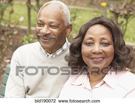 Senior African couple hugging and smiling outdoors View Large Photo Image Stock Image - Senior African couple hugging and smiling outdoors. Fotosearch