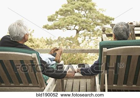 Senior couple holding hands outdoors View Large Photo Image Stock Image - Senior couple holding hands outdoors. Fotosearch