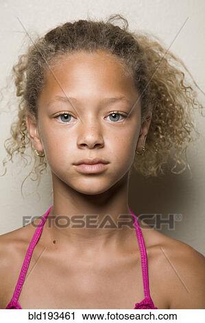 Stock Image - Serious mixed race girl. Fotosearch