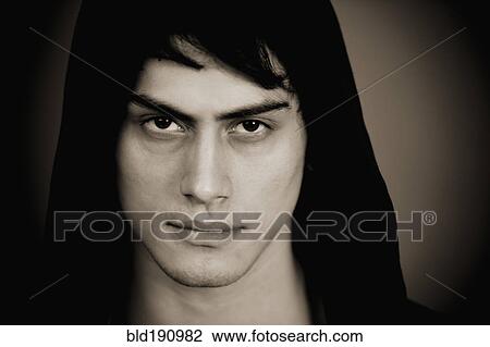 Serious mixed race man in hooded jacket View Large Photo Image Stock Image - Serious mixed race man in hooded jacket. Fotosearch