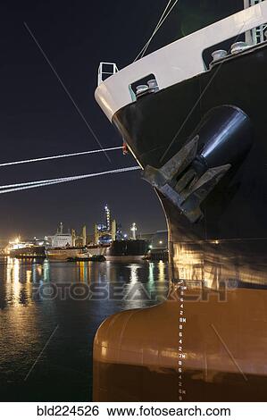 Stock Photograph - Ships moored at commercial dock at night. Fotosearch