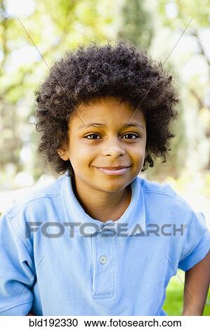 Stock Image - Smiling African boy. Fotosearch