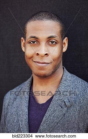 Smiling Black man wearing jacket View Large Photo Image Picture - Smiling Black man wearing jacket. Fotosearch