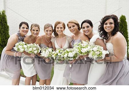 Smiling bridal party standing with bride View Large Photo Image Picture - Smiling bridal party standing with bride. Fotosearch