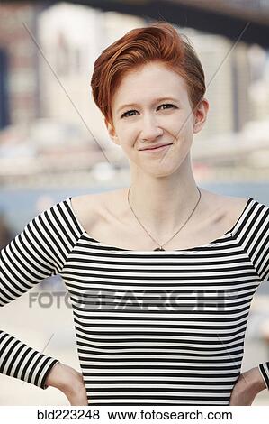 Stock Photo - Smiling Caucasian woman with nose ring. Fotosearch