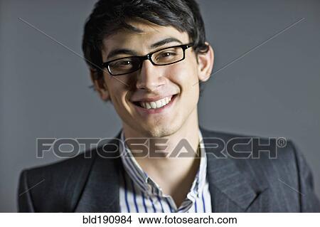Picture - Smiling mixed race businessman in eyeglasses. Fotosearch