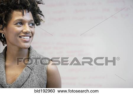 Stock Image - Smiling mixed race businesswoman. Fotosearch